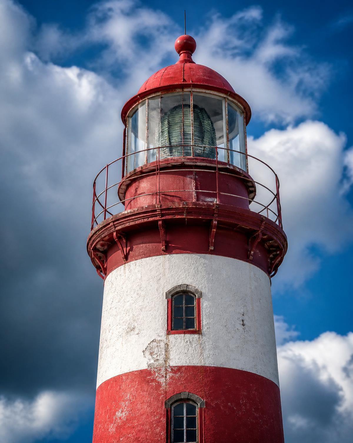 Alnes lighthouse tower against dramatic sky